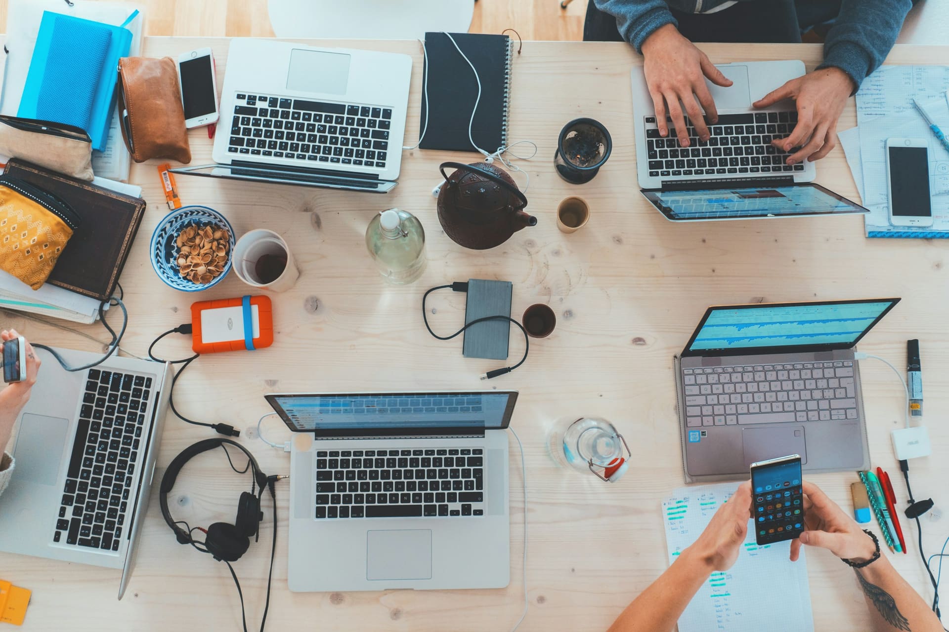 Person reading and writing at desk